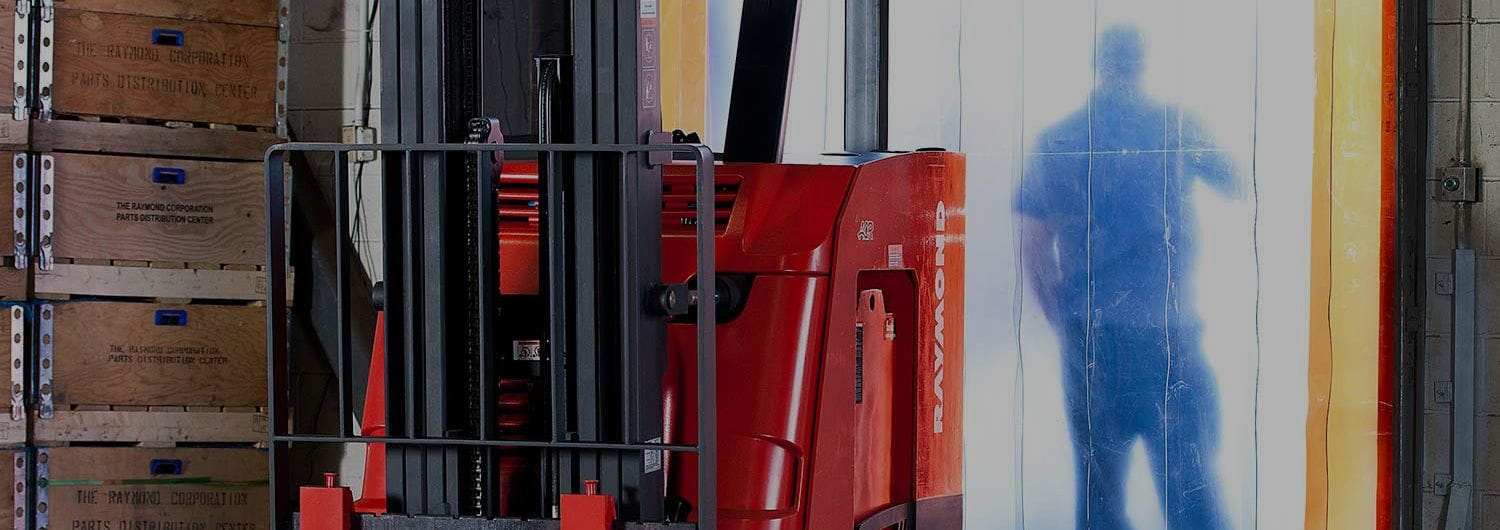 Worker taking a break behind plastic curtains. Concept for warehouse labor management