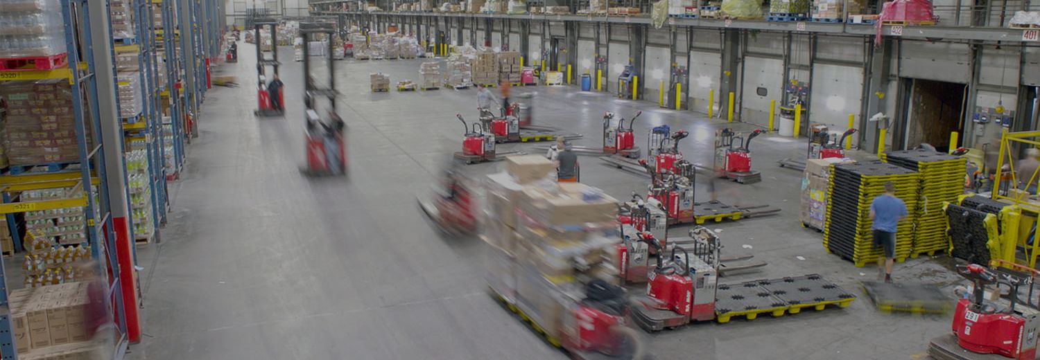 Warehouse with fast moving Raymond forklifts. Concept for forklift location tracking systems.