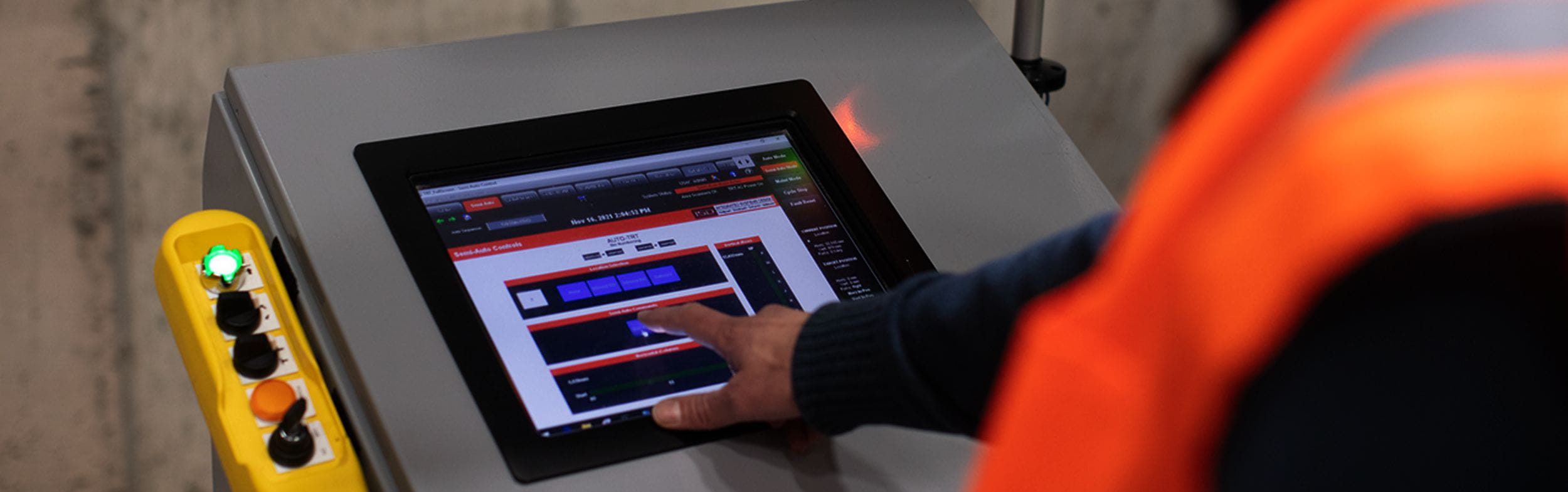 Warehouse worker pushing button on system. Concept for warehouse systems integration