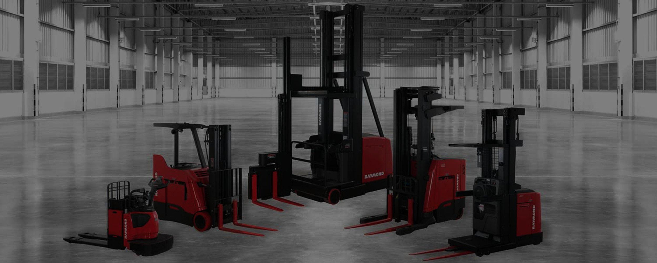 Red Raymond forklifts in a row