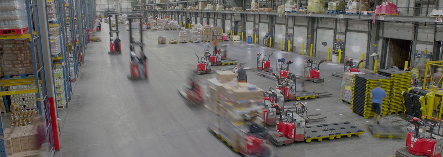 Warehouse with numerous Raymond forklifts. Concept for warehouse intralogistics systems.