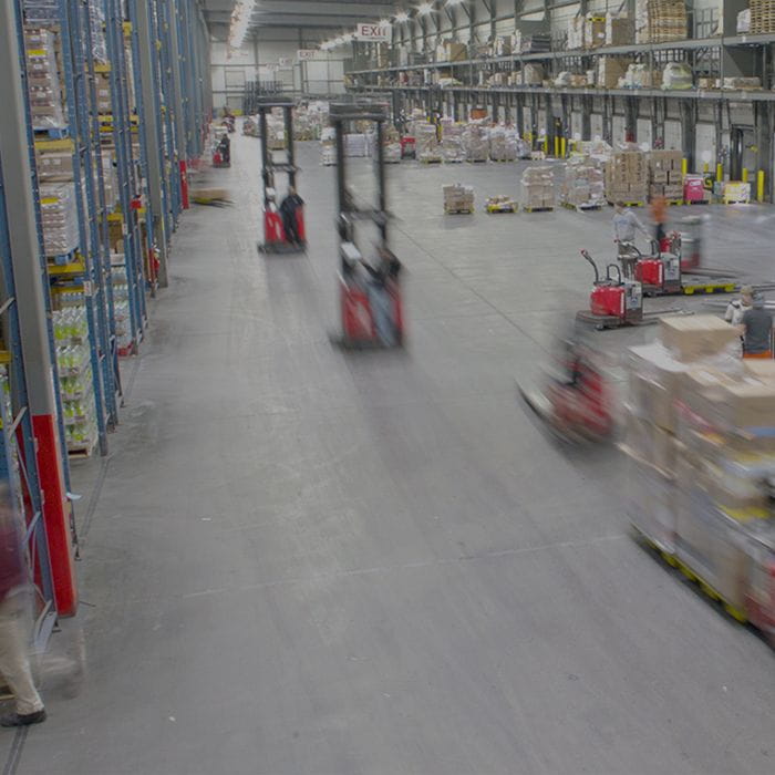 Warehouse with numerous Raymond forklifts. Concept for warehouse intralogistics systems.