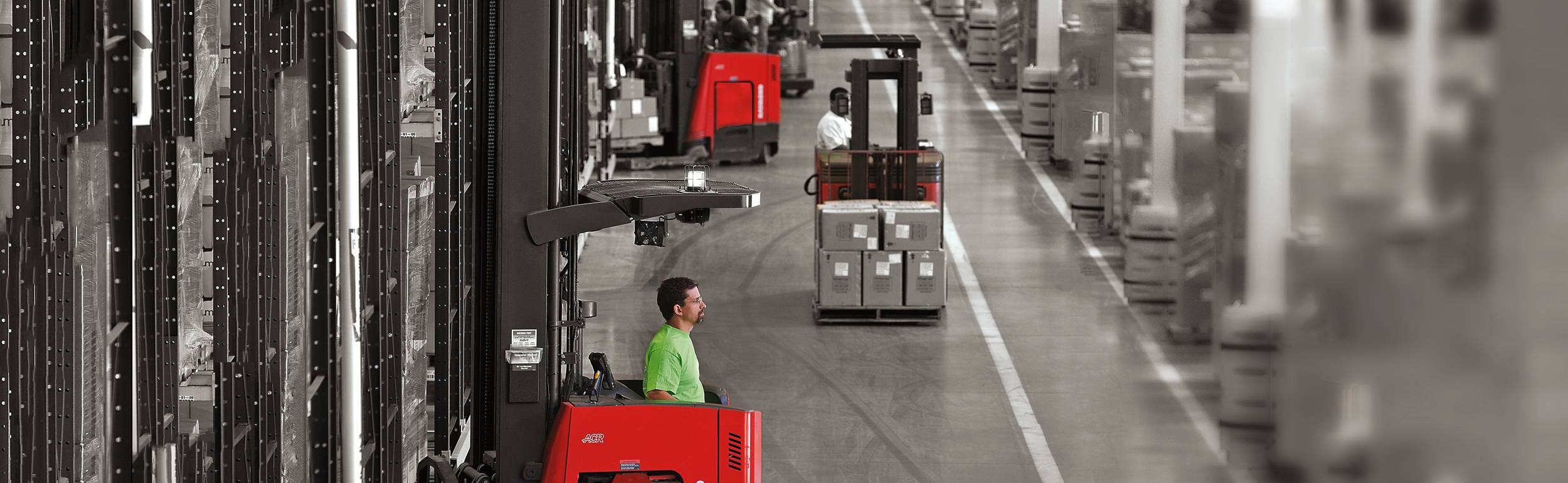 Grayscale warehouse with red forklifts. concept for warehouse optimization