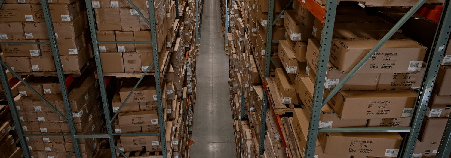 Two aisles of boxes on warehouse storage racking